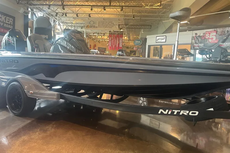The Image of 2026 Nitro Z20 XL Pro boat displayed in showroom with sleek design. - 0