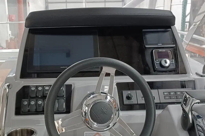Slide: The Image of 2024 Jeanneau Leader 9.0 WA dashboard with steering wheel and navigation controls. - 10