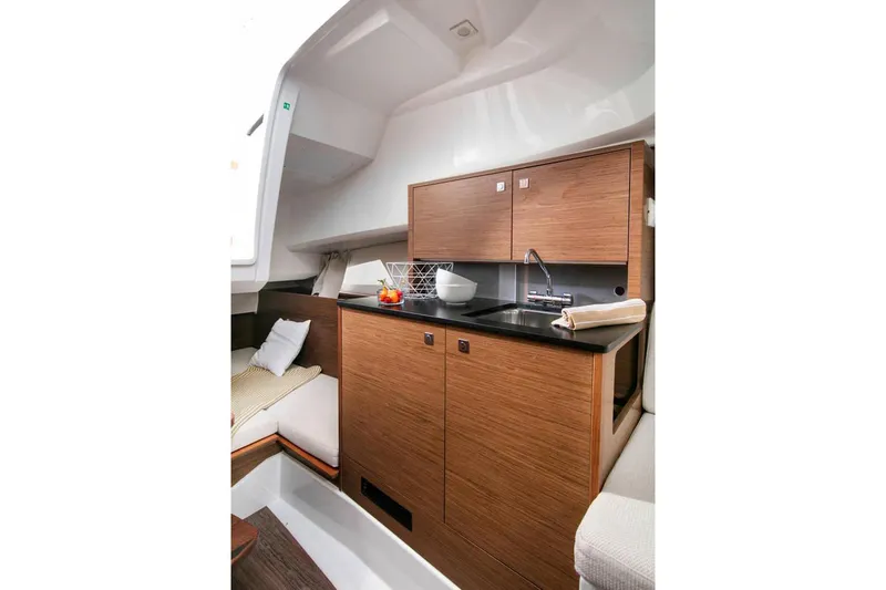 Slide: The Image of 2024 Jeanneau Leader 9.0 WA boat interior with seating and dual engines. - 13