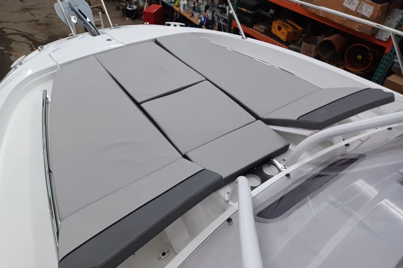 Slide: The Image of 2024 Jeanneau Leader 9.0 WA boat with cushioned deck area. - 5