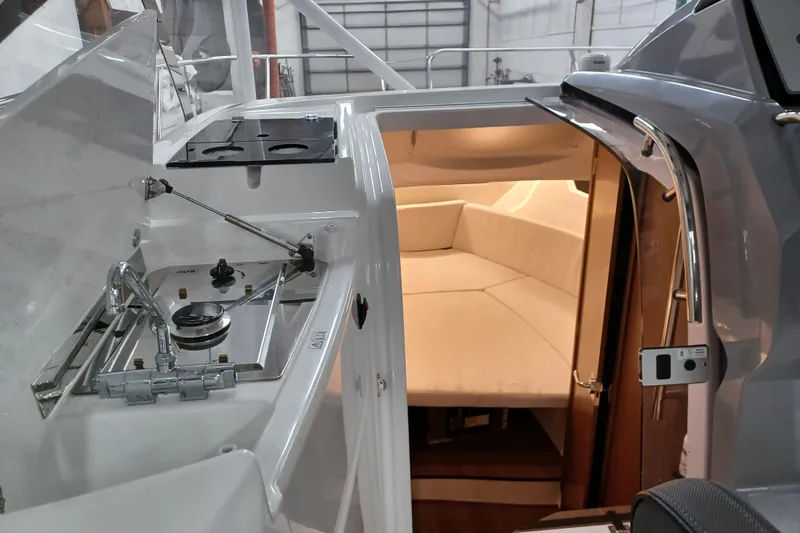 Slide: The Image of 2024 Jeanneau Leader 9.0 WA interior with kitchenette and cozy cabin. - 8