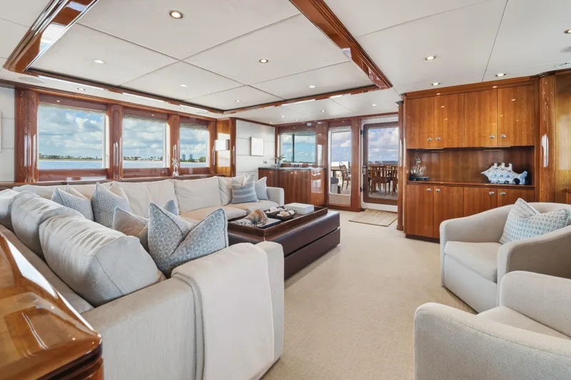 Slide: The Image of Luxurious interior of 1990 Delta Expedition yacht with elegant seating and panoramic windows. - 12