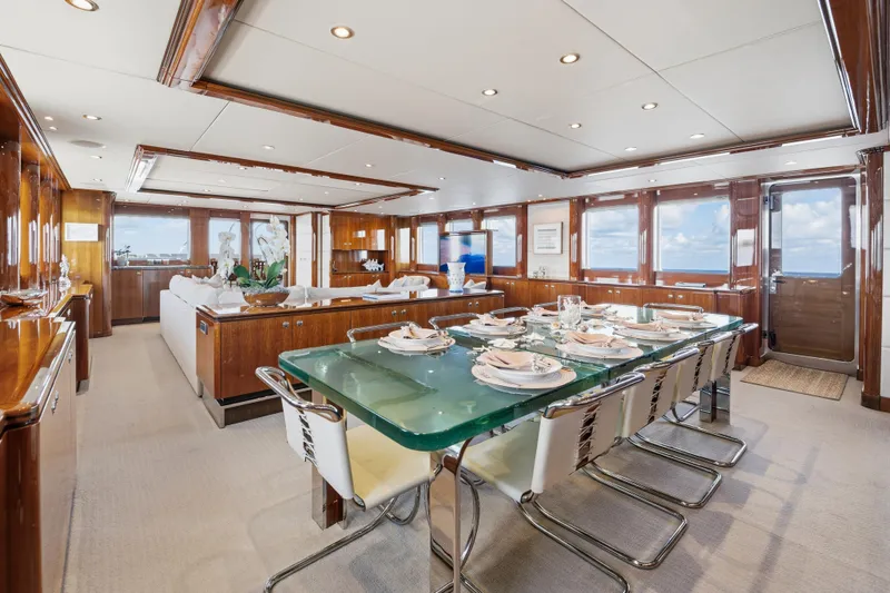 Slide: The Image of Luxurious dining area on 1990 Delta Expedition yacht with elegant table setting and panoramic windows. - 14