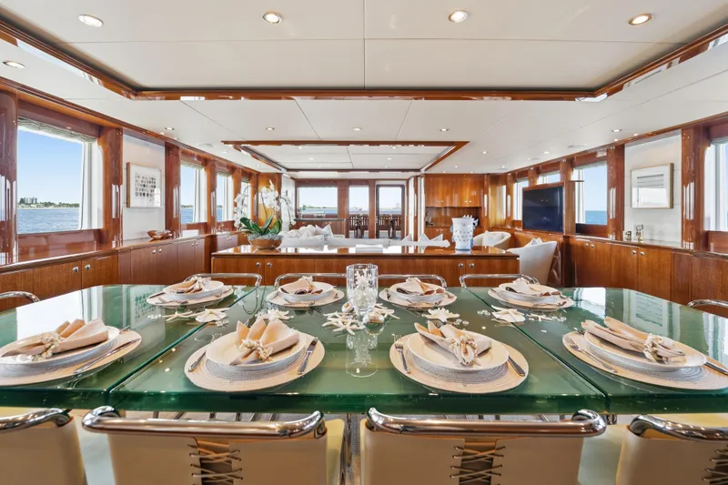 Slide: The Image of Luxurious dining area on 1990 Delta Expedition yacht with elegant table setting and ocean view. - 16