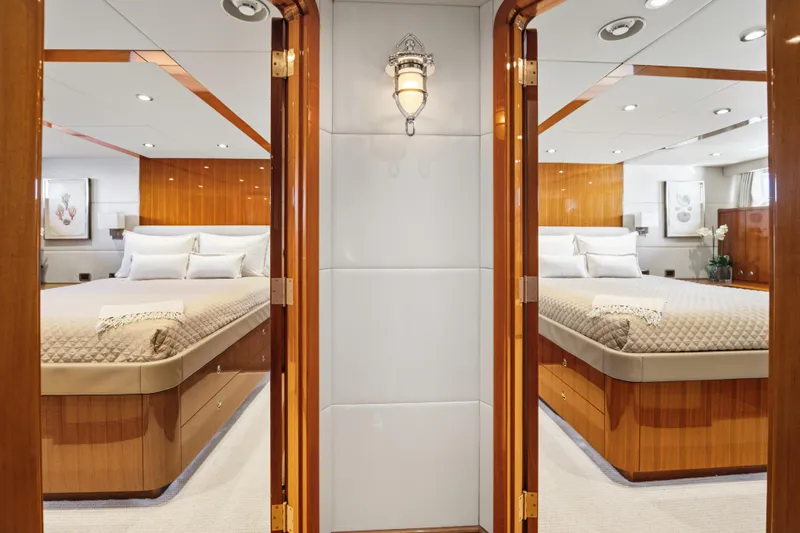 Slide: The Image of Luxurious 1990 Delta Expedition yacht interior with elegant twin bedrooms and polished wood finishes. - 23