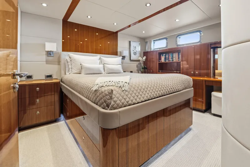 Slide: The Image of Luxurious cabin interior of 1990 Delta Expedition yacht with elegant wood finishes and cozy bedding. - 27