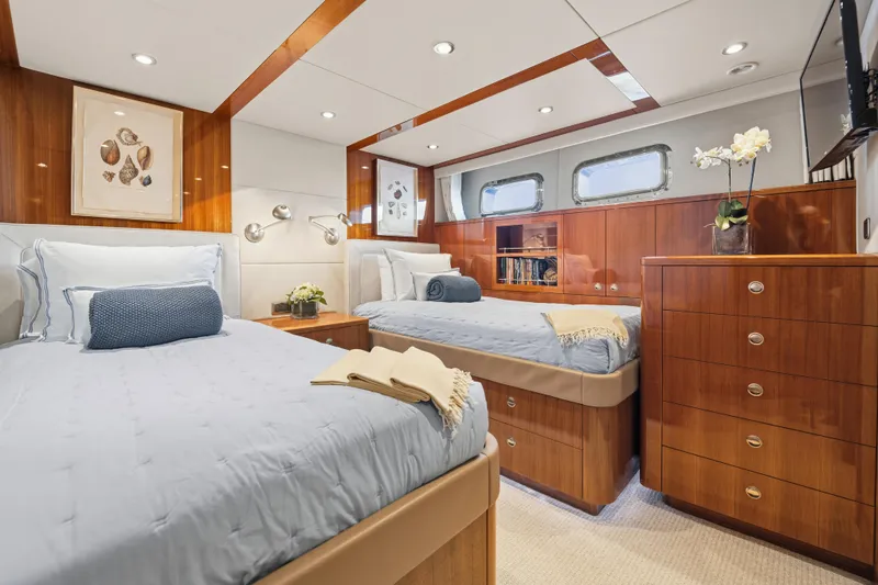 Slide: The Image of Luxurious 1990 Delta Expedition yacht cabin with twin beds and elegant wood finish. - 28