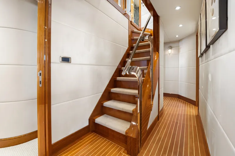 Slide: The Image of Luxurious interior of 1990 Delta Expedition yacht with wooden staircase and modern lighting. - 29