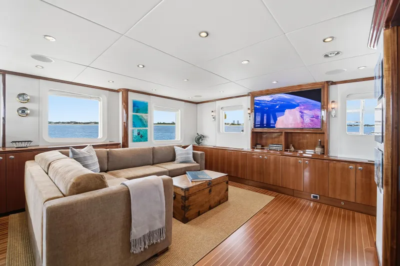 Slide: The Image of Luxurious 1990 Delta Expedition yacht interior with plush seating, wooden accents, and ocean views. - 31