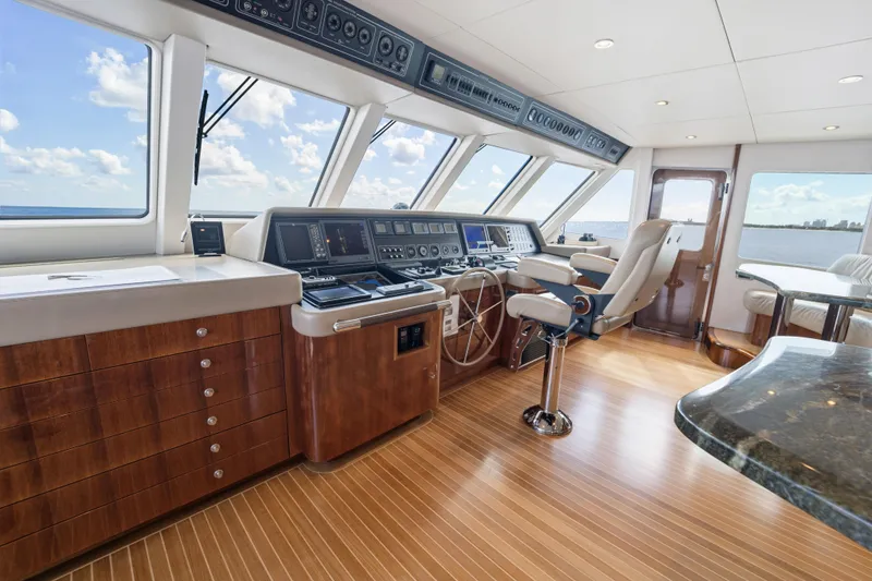 Slide: The Image of Luxurious 1990 Delta Expedition yacht helm with modern controls and panoramic ocean views. - 32