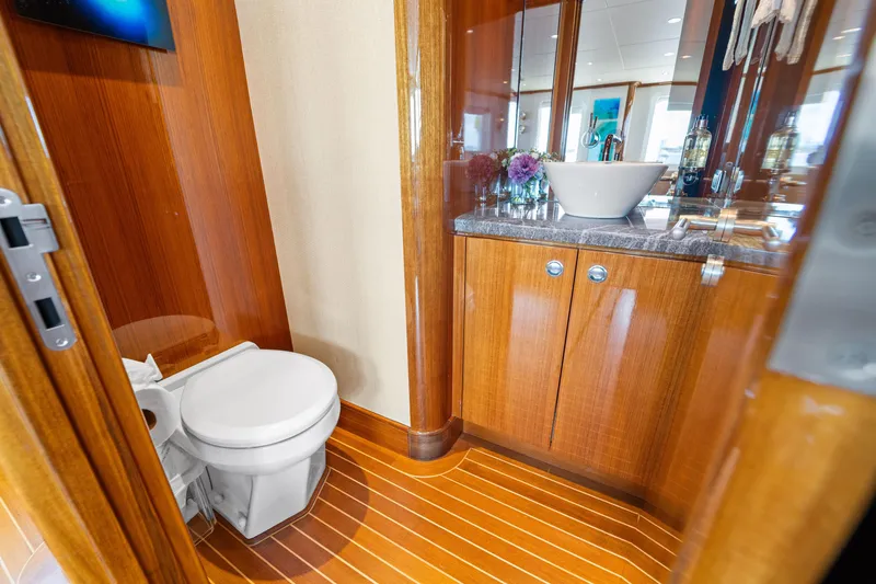 Slide: The Image of Luxurious 1990 Delta Expedition yacht bathroom with wooden cabinetry and modern fixtures. - 35