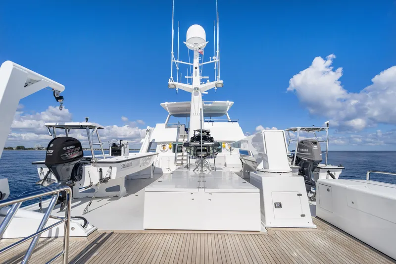 Slide: The Image of 1990 Delta Expedition yacht deck with equipment, clear blue sky, and ocean view. - 36