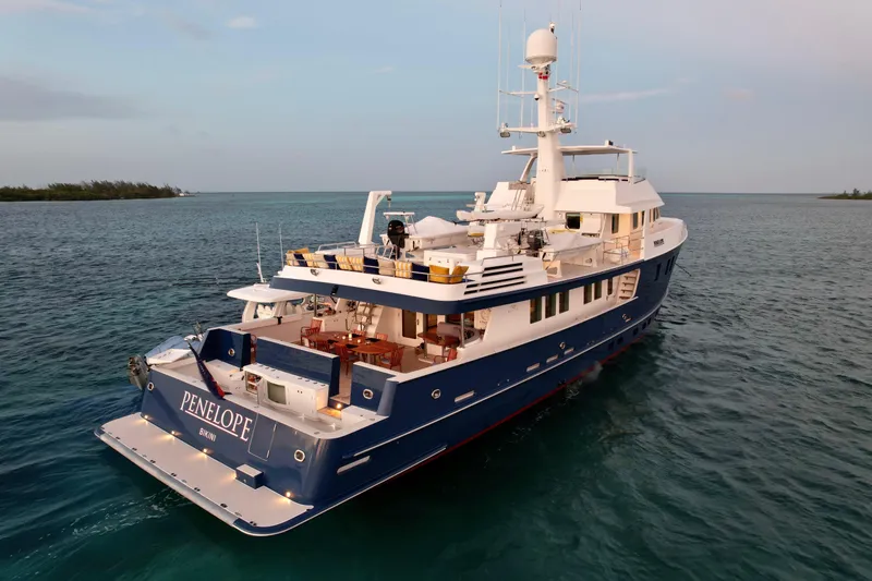 Slide: The Image of Luxurious 1990 Delta Expedition yacht "Penelope" cruising in serene ocean waters. - 4