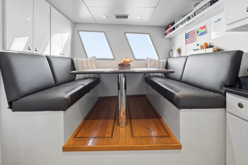 Slide: The Image of Luxurious 1990 Delta Expedition yacht interior with sleek seating and modern decor. - 47