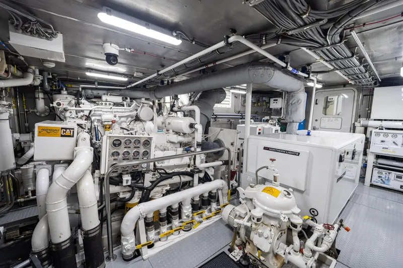 Slide: The Image of Engine room of a 1990 Delta Expedition yacht, featuring CAT and Northern Lights equipment. - 48