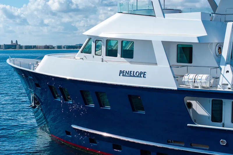 Slide: The Image of Luxury yacht "Penelope" on water, Delta Expedition 1990 model, clear sky background. - 56