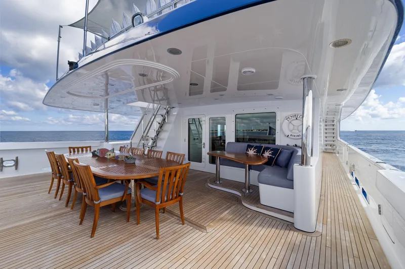 Slide: The Image of Luxurious 1990 Delta Expedition yacht deck with dining area and ocean view. - 8