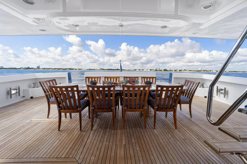 Slide: The Image of Luxury yacht deck with dining table, wooden chairs, ocean view; Delta Expedition 1990. - 9