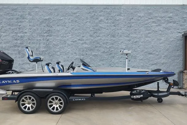 The Image of 2026 Caymas CX20 Pro bass boat on trailer, sleek design, blue and gray color scheme. - 1