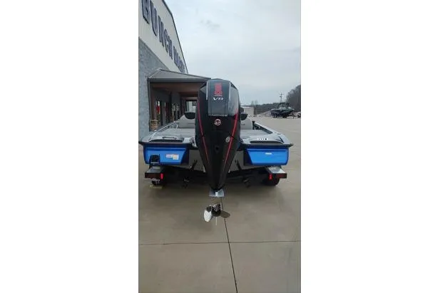 Slide: The Image of 2026 Caymas CX20 Pro boat with powerful outboard motor, parked on concrete surface. - 10