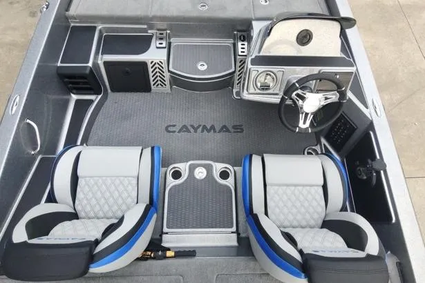 Slide: The Image of 2026 Caymas CX20 Pro boat interior with dual seats and steering console. - 7