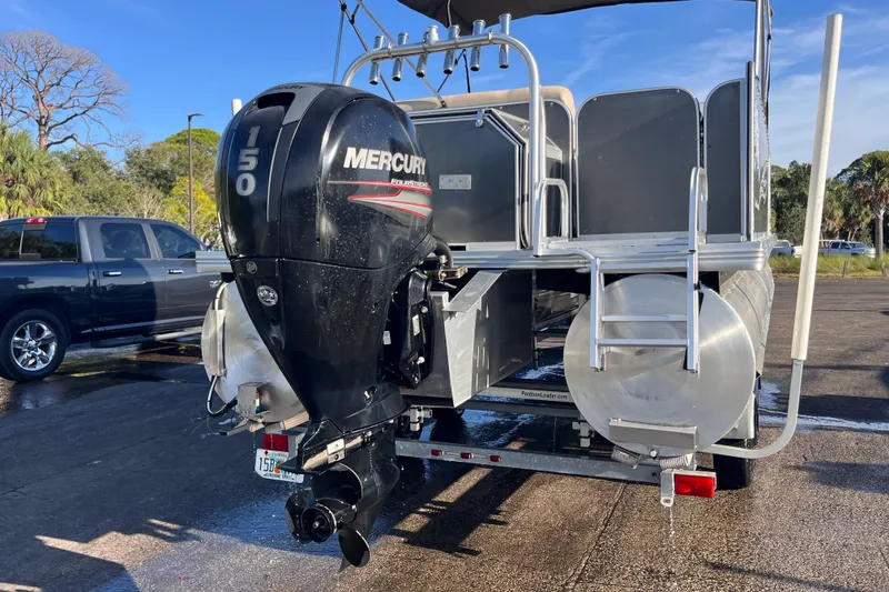 Slide: The Image of 2017 Fiesta 22 Beachcomber pontoon boat with Mercury 150 outboard motor on trailer. - 2
