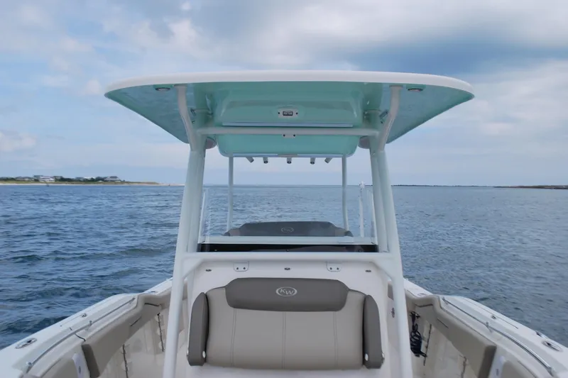 Slide: The Image of 2022 Key West 263 FS boat on open water under a cloudy sky. - 9