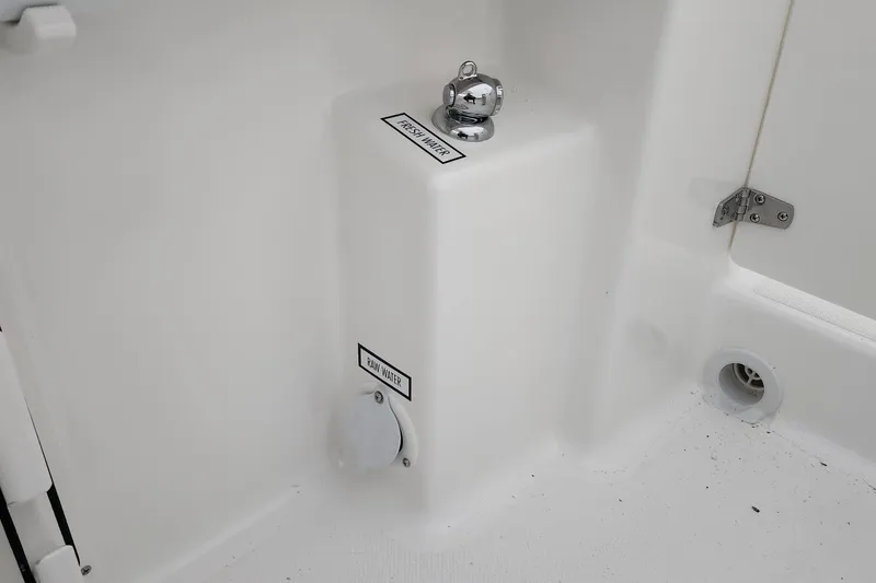 Slide: The Image of 2026 Pursuit DC 266 Dual Console boat water system components. - 31