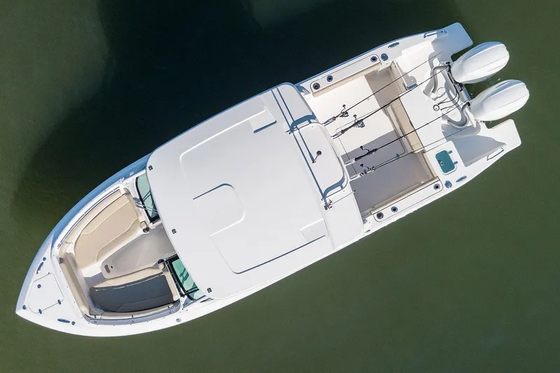 Slide: The Image of Manufacturer Provided Image: Aerial view of 2025 Pursuit DC 266 Dual Console boat on water. - 40