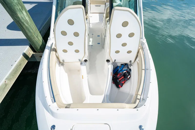Slide: The Image of Manufacturer Provided Image: 2025 Pursuit DC 266 Dual Console boat interior with seating and gear bag. - 46