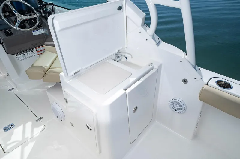 Slide: The Image of Manufacturer Provided Image: 2025 Pursuit DC 266 Dual Console boat interior with open storage compartment. - 52