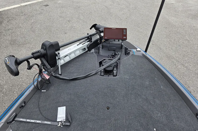 Slide: The Image of 2026 Skeeter FXR21 Apex boat deck with trolling motor and electronic display. - 11