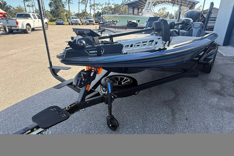 Slide: The Image of 2026 Skeeter FXR21 Apex boat on trailer in outdoor setting. - 15