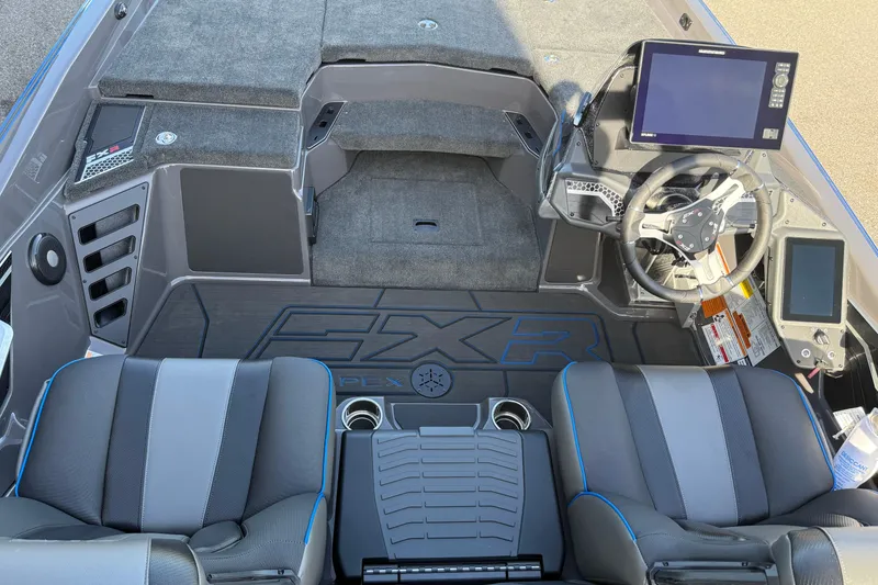 Slide: The Image of 2026 Skeeter FXR21 Apex boat interior with advanced dashboard and seating. - 3
