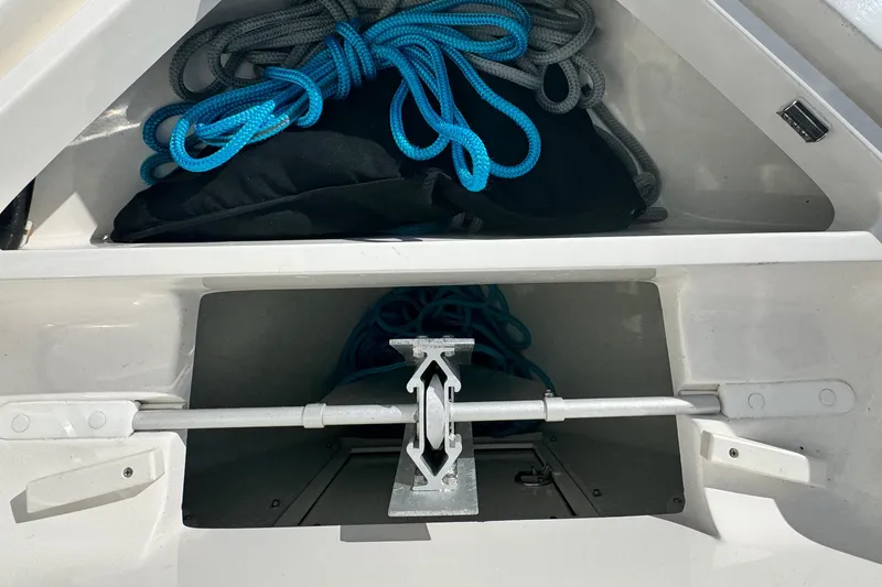 Slide: The Image of 2024 SeaVee 290B boat storage compartment with ropes and anchor. - 26