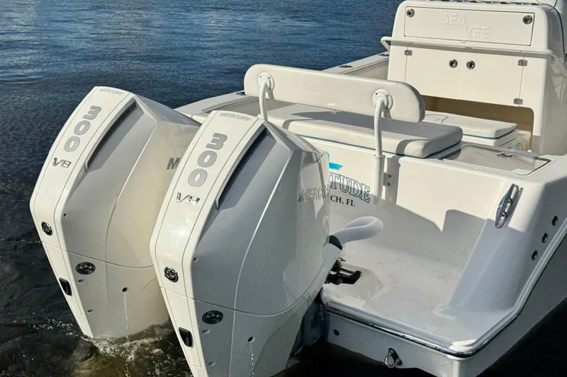 Slide: The Image of 2024 SeaVee 290B boat with dual Mercury 300 V8 engines in water. - 9