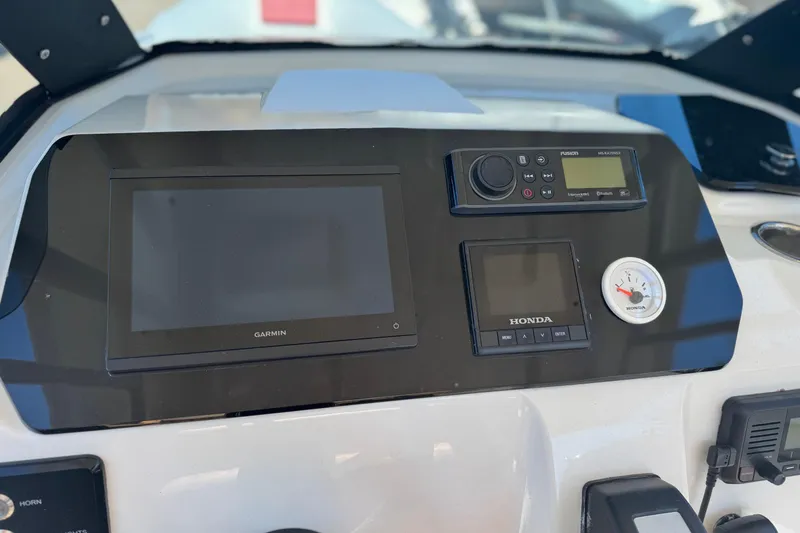 Slide: The Image of Dashboard of 2022 Brig Eagle 8 with Garmin and Honda controls. - 13