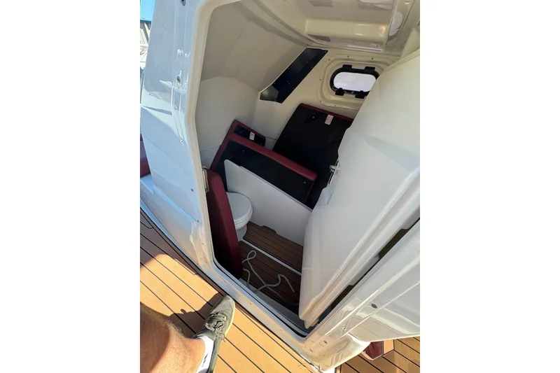 Slide: The Image of 2022 Brig Eagle 8 boat interior with compact cabin and wooden flooring. - 15