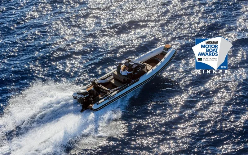 Slide: The Image of 2022 Brig Eagle 8 boat with Honda 250 engine on display outdoors. - 16