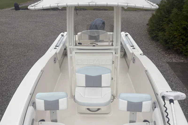 Slide: The Image of 2021 Robalo R202 Explorer boat interior with seating and steering console. - 5