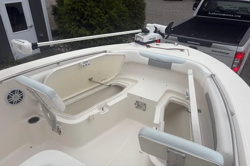 Slide: The Image of 2021 Robalo R202 Explorer boat interior with open storage compartments and seating. - 8