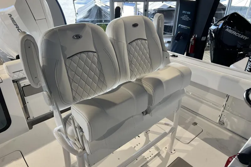 Slide: The Image of 2025 Sportsman Open 252 Center Console boat with luxurious white seating. - 3