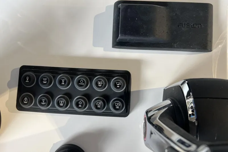 Slide: The Image of Control panel and components of 2025 Sportsman Open 252 Center Console boat. - 5