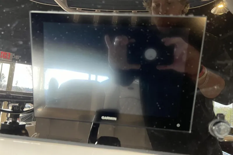 Slide: The Image of Reflection on Garmin screen in 2025 Sportsman Open 252 Center Console boat. - 6