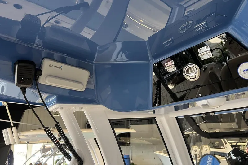 Slide: The Image of 2025 Sportsman Open 252 Center Console with Garmin equipment and sleek blue interior design. - 8