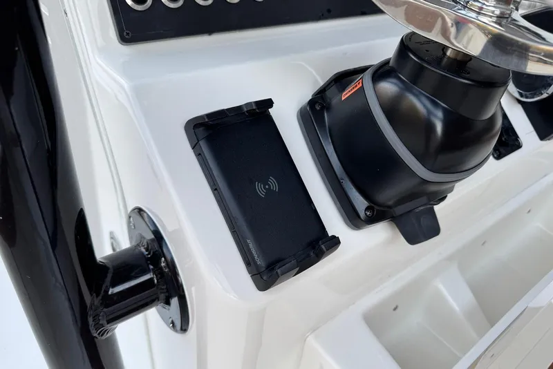 Slide: The Image of Control panel of 2026 Key West 230 Bay Reef boat with wireless charging pad. - 11