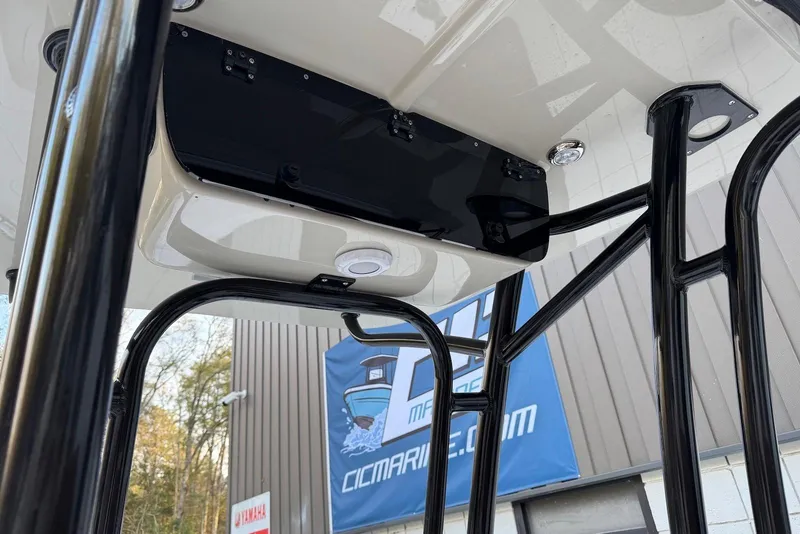 Slide: The Image of 2026 Key West 230 Bay Reef boat T-top structure with mounted electronics. - 13