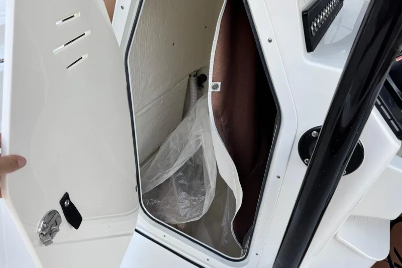 Slide: The Image of Open storage compartment on 2026 Key West 230 Bay Reef boat. - 15