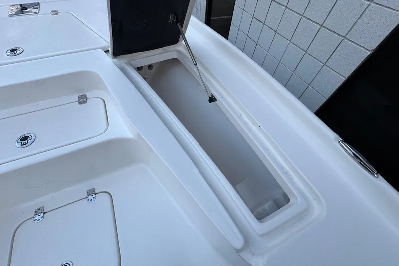 Slide: The Image of Open storage compartment on 2026 Key West 230 Bay Reef boat deck. - 20