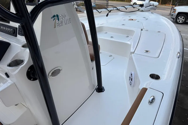 Slide: The Image of 2026 Key West 230 Bay Reef boat interior with console and seating. - 26